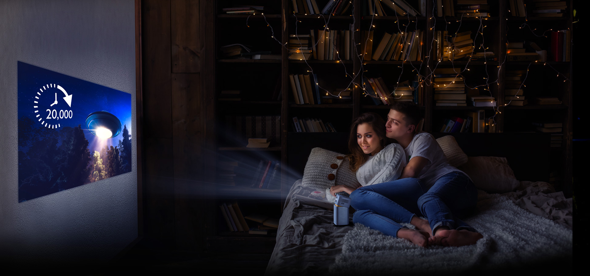 A couple uses portable projector for movie-watching in a bedroom